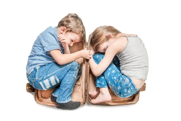 Boy and girl in old brown suitcase on a white background. Isolat — Stock Photo, Image