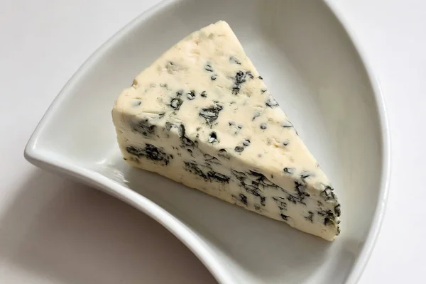 Blue cheese on a white plate