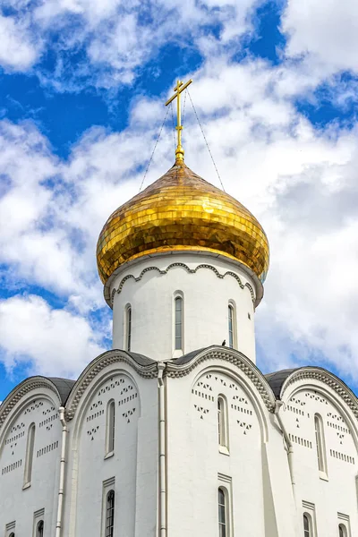 Moscow, Russia, 08.21.2020. Gilded dome with the cross of the old believers Church of St. Nicholas the Wonderworker against the blue sky
