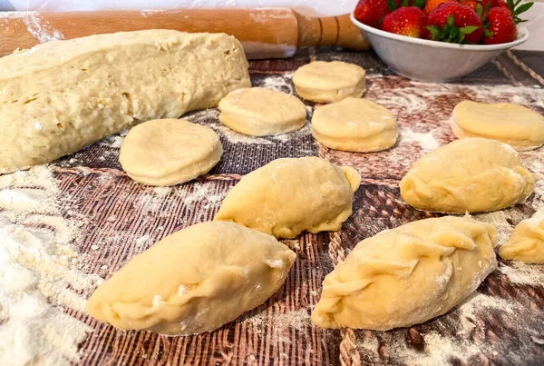 Uncooked Dumplings Strawberries Dough Abstract Wooden Surface Process Preparing Traditional Royalty Free Stock Photos