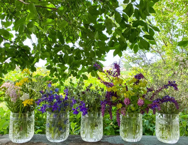 Bright Multi Colored Wildflowers Decorative Glass Vases Abstract Wooden Surface — Stock Photo, Image