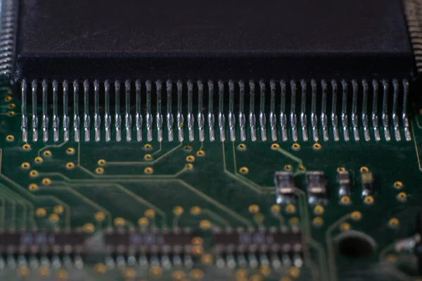 Macro photo of printed circuit board with installed SMD electronics components