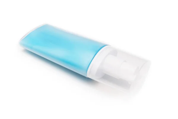 Un conteiner plástico azul, botella de crema hidratante, loción con dosificador y tapa aislada sobre fondo blanco —  Fotos de Stock