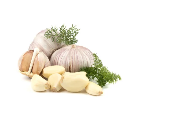 Fresh garlic in heads and divided into teeth on a white isolated background — Stock Photo, Image