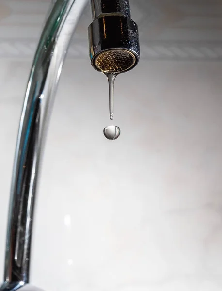 A poorly closed tap leaks water