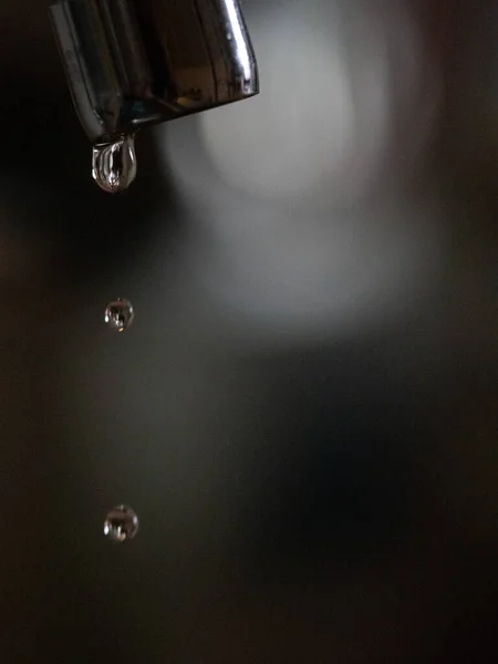 A poorly closed tap leaks water