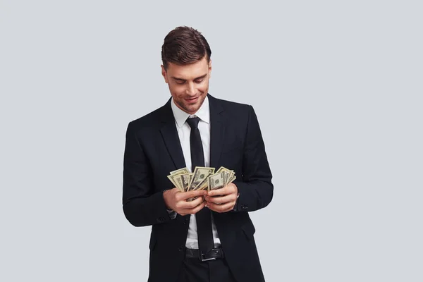 Executive Businessman Smiling Counting Money Studio — Stock Photo, Image