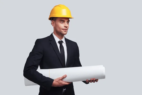 Businessman Yellow Hardhat Carrying Blueprint Studio — Stock Photo, Image