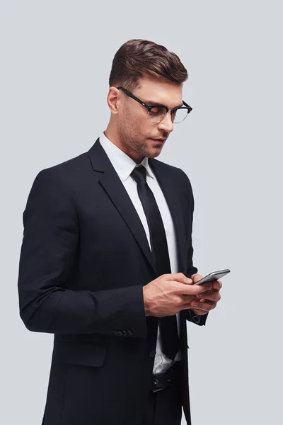Handsome Young Businessman Using Smart Phone Studio — Stock Photo, Image