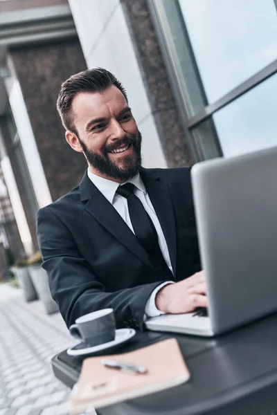 Smiling Businessman Using Laptop While Sitting Cafe Outdoors — Stock Photo, Image