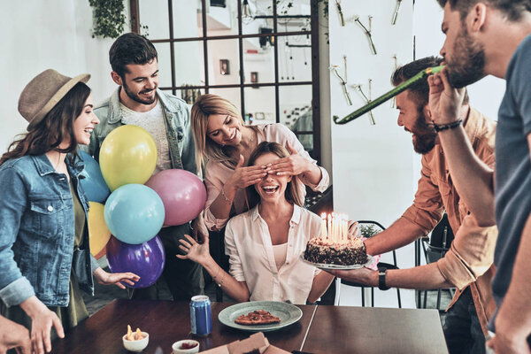 happy people celebrating birthday, smiling woman with covered eyes waiting for cake 