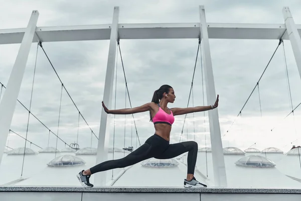 Sportive Woman Stretching Outdoors Roof Modern Building — Stock Photo, Image