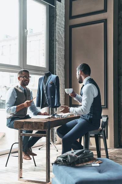 businessmen working on trending design at table with tea cup