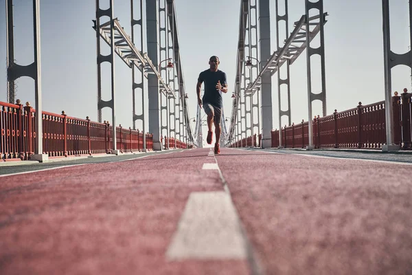 Full Length Sportive Man Jogging Bridge Outdoors Low Angle View — Stock Photo, Image