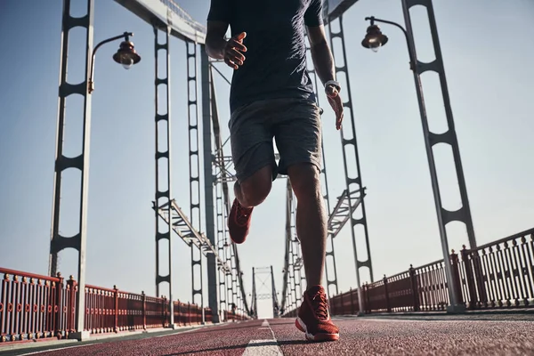 Man Jogging Bridge Outdoors Low Angle View Cropped Image — Stock Photo, Image