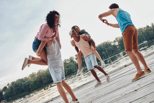 Happy Couples Spending Carefree Time Wooden Pier Men Carrying Shoulders — Stock Photo, Image