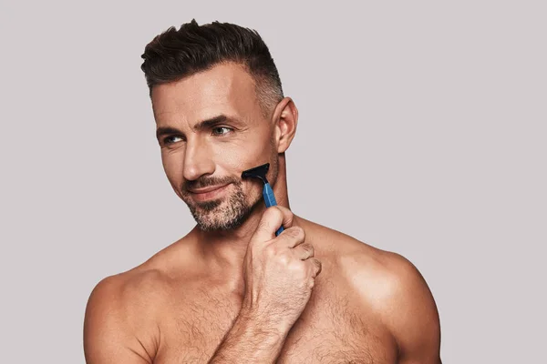 Charming Young Man Shaving Smiling While Standing Grey Background — Stock Photo, Image