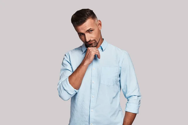 Thoughtful Young Man Keeping Hand Chin Looking Camera — Stock Photo, Image