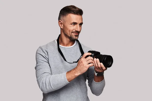 Handsome Journalist Man Holding Digital Camera Smiling While Standing Grey — Stock Photo, Image