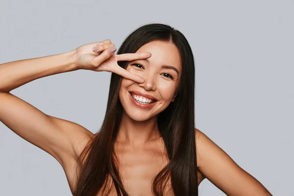 Shirtless Asian Woman Gesturing Fingers Eye Smiling While Standing Grey — Stock Photo, Image