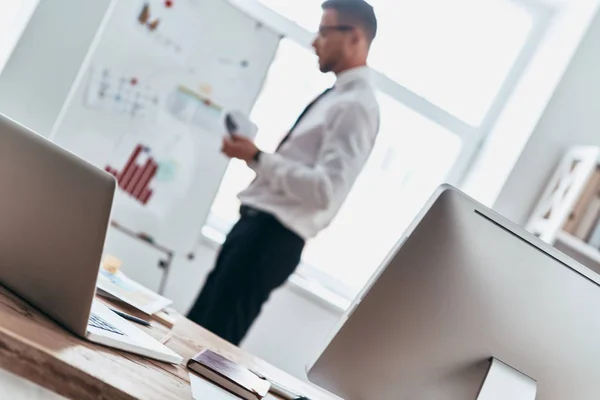 Busy Young Man Working Information Graph While Standing Office — Stock Photo, Image