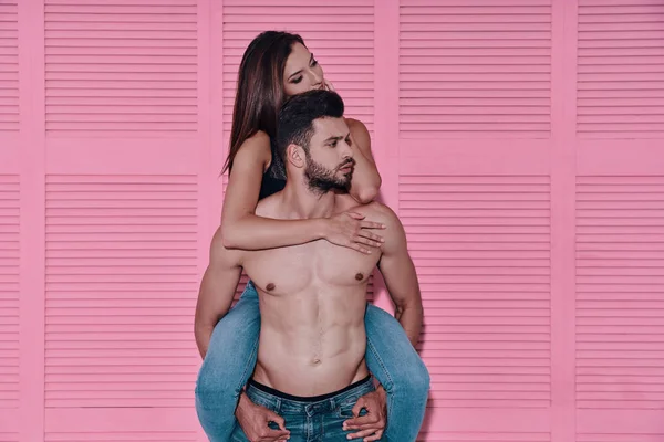 Handsome Shirtless Man Carrying His Girlfriend Shoulders While Standing Pink — Stock Photo, Image