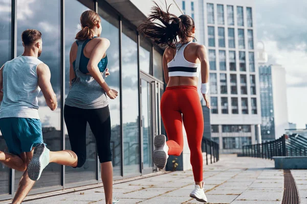 Rückansicht Von Menschen Sportkleidung Beim Joggen Auf Dem Bürgersteig Freien — Stockfoto