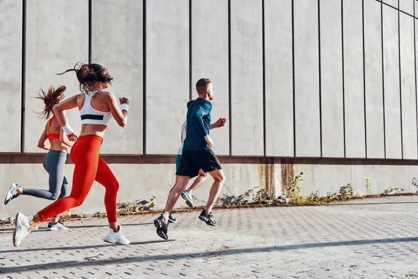 Personas Deportivas Ropa Deportiva Corriendo Aire Libre Pared — Foto de Stock