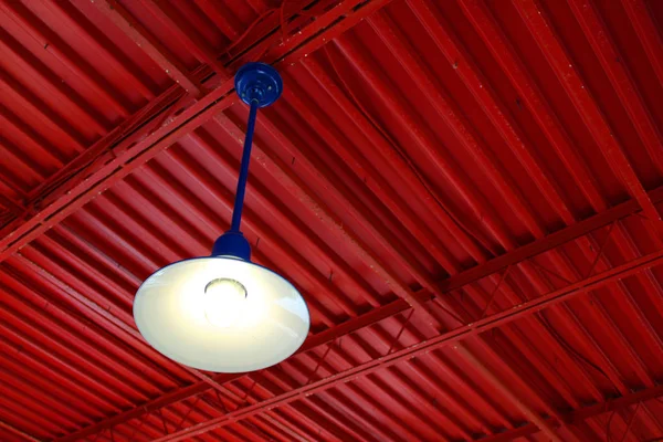 Red Metal Roof Royal Blue Hanging Light — Stock Photo, Image