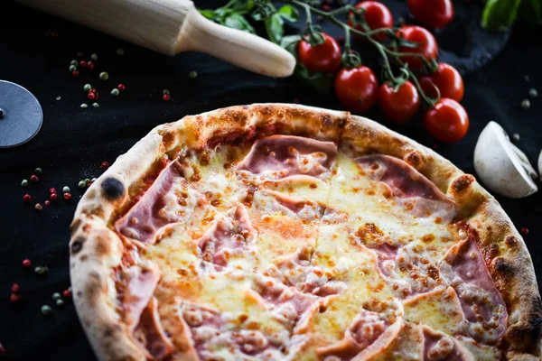 deliciouse italian pizza with prosciutto cotto, pepperoni & cheese