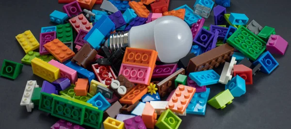 Light bulb and plastic blocks. Idea concept