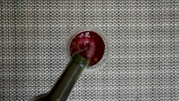 Birds Eye Shot Pouring Red Wine Glass — стоковое видео