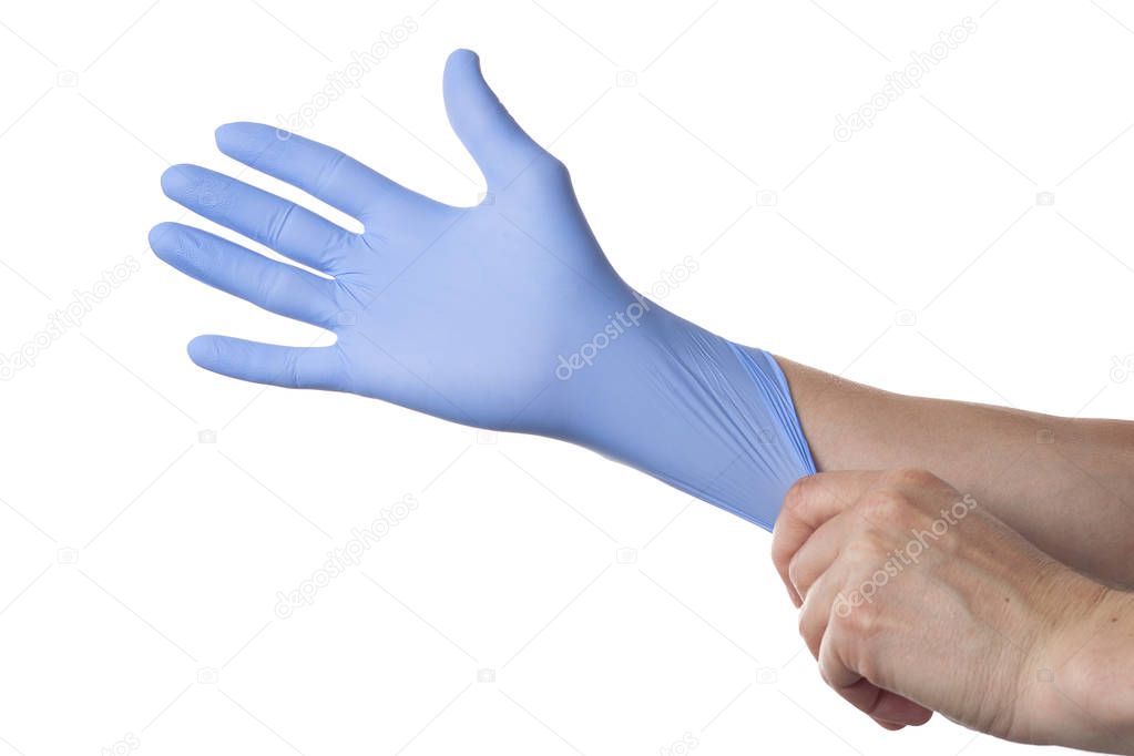 Doctor putting on protective gloves, isolated on white