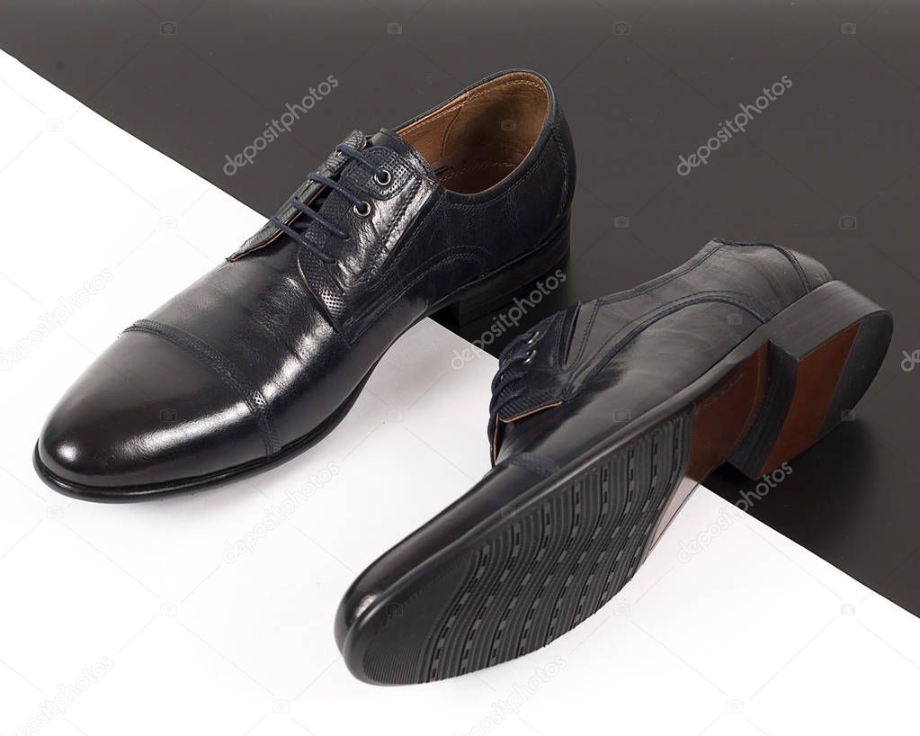 Black men's leather shoes isolated on white background