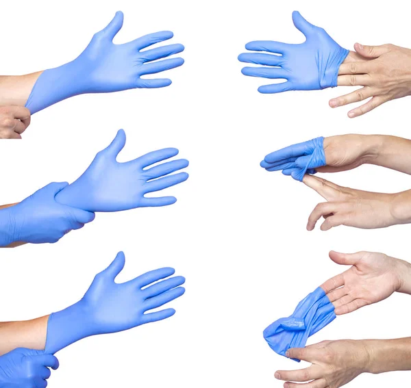 Lekarz zdjąć jej niebieskie Rękawice medyczne. Białe tło — Zdjęcie stockowe
