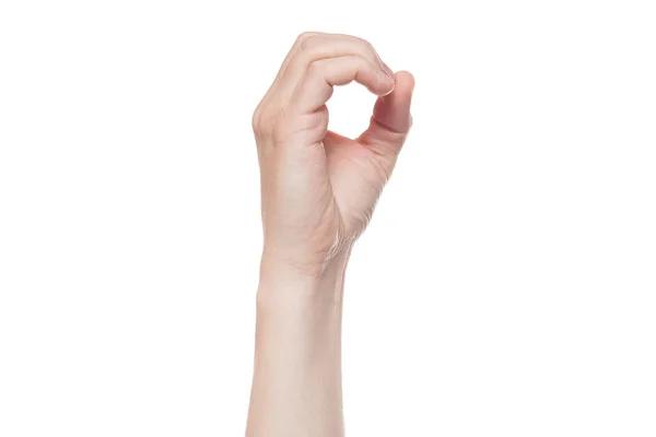 Yuvarlak, delik, sıfır anlamına gelen bir el işareti. beyaz arka planda