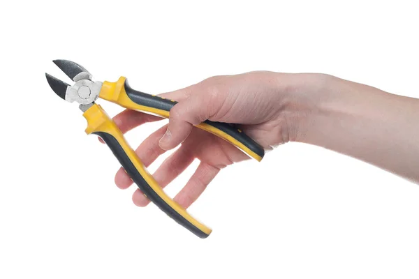 Mão de homem segurando um cortador de fio preto e amarelo. Aberto, limpo , — Fotografia de Stock