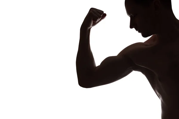 Young Muscular bodybuilder demonstrates his bicep on white backg — Stock Photo, Image