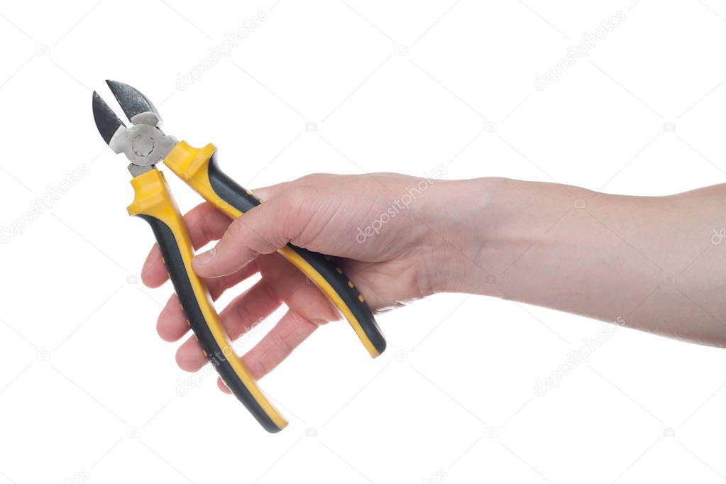Man's hand holding a black and yellow wire cutter. Open, clean, 