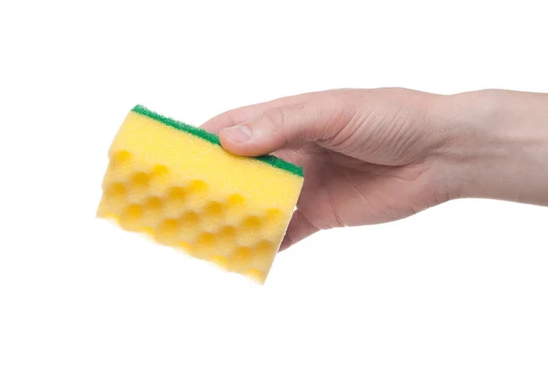 Male hand holding a yellow cleaning sponge isolated on a white b — Stock Photo, Image