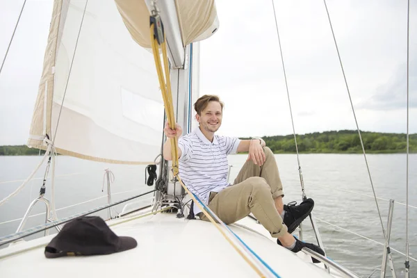 Handsome young man on yach — Stock Photo, Image