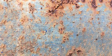 Paslı, eski, pürüzlü, metal bir doku. İç dekorasyon ve endüstriyel yapı tasarımı için koyu paslı metal desen arka planı. Vintage effec