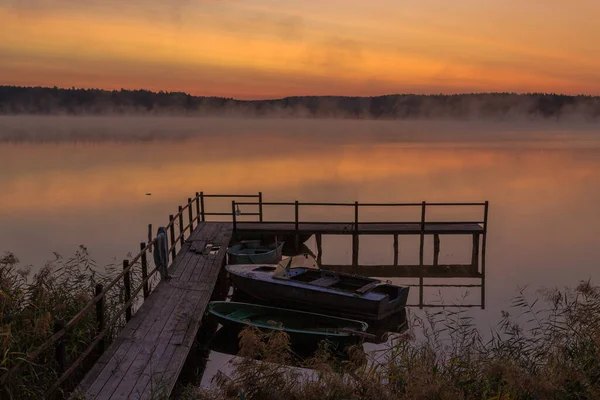 Walk with morning fog on the lake. Fishing at dawn. Kiev region, Ukraine. 20 September 2020