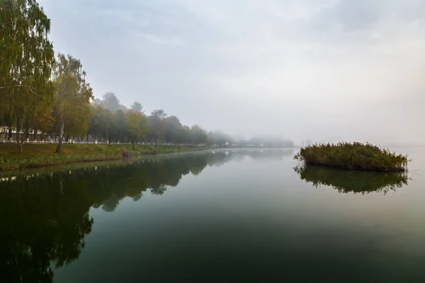 Walk on the lake in the morning fog. Fishing at dawn. Kiev region, Ukraine. September 10, 2020