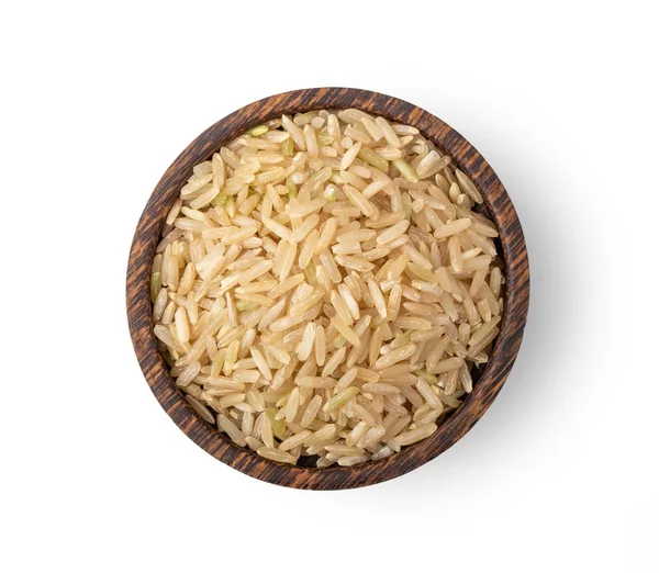 Brauner Reis in Holzschale isoliert auf weißem Hintergrund. Ansicht von oben — Stockfoto