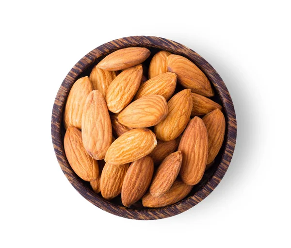 Kacang Almond di mangkuk kayu terisolasi pada latar belakang putih — Stok Foto