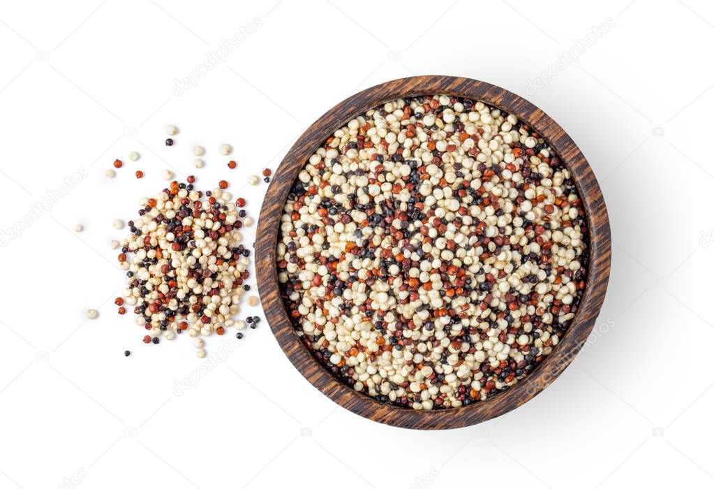 Pile of mixed raw quinoa, grain in wood bowl isolated on white b