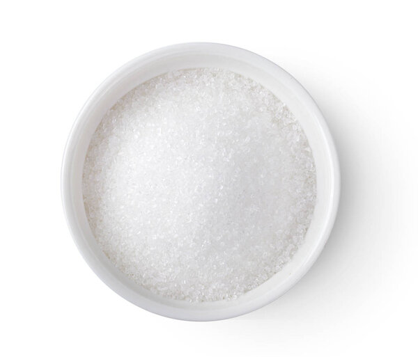 Bowl of white sugar isolated on white background, top view