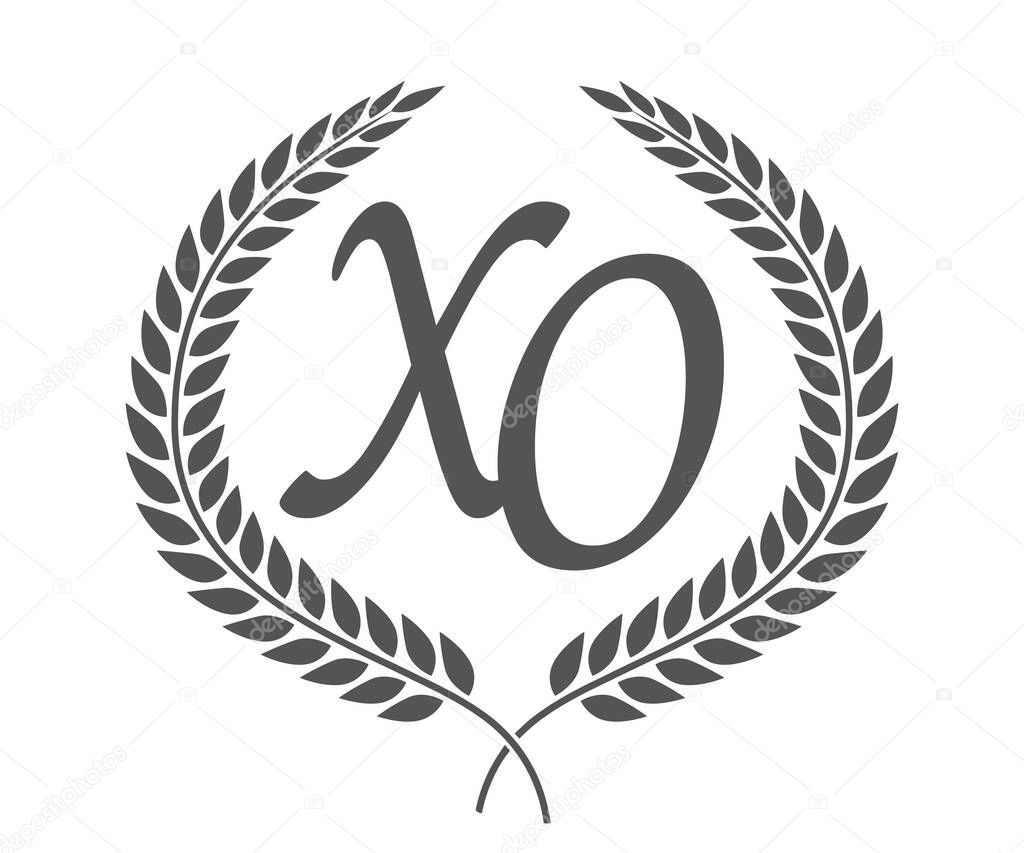 Initial letter X and O, XO monogram logo design with laurel wreath. Luxury emblem with calligraphy font.