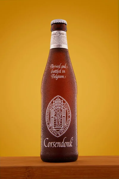 Beer Bottle Orange Background Wooden Table Corsendonk Brewed Bottled Belgium — Stock Photo, Image